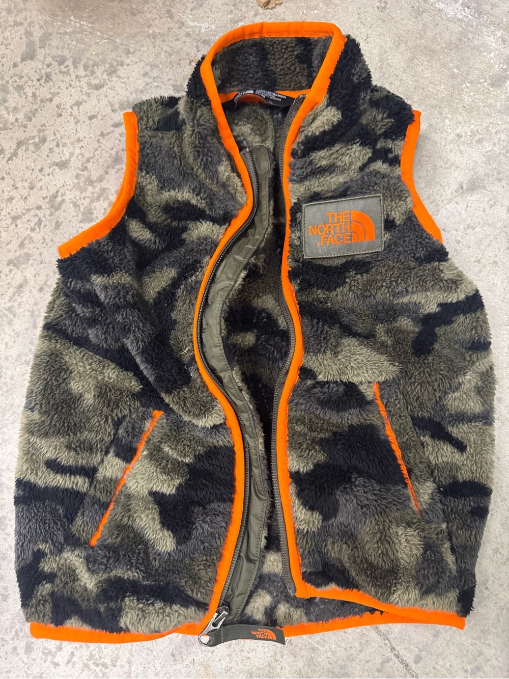 The North Face Toddler Sherpa Vest in Olive Camo with Orange Trim